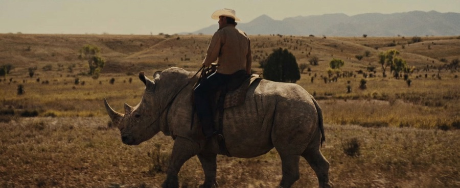 AI-generated image: cowboy herding rhinos